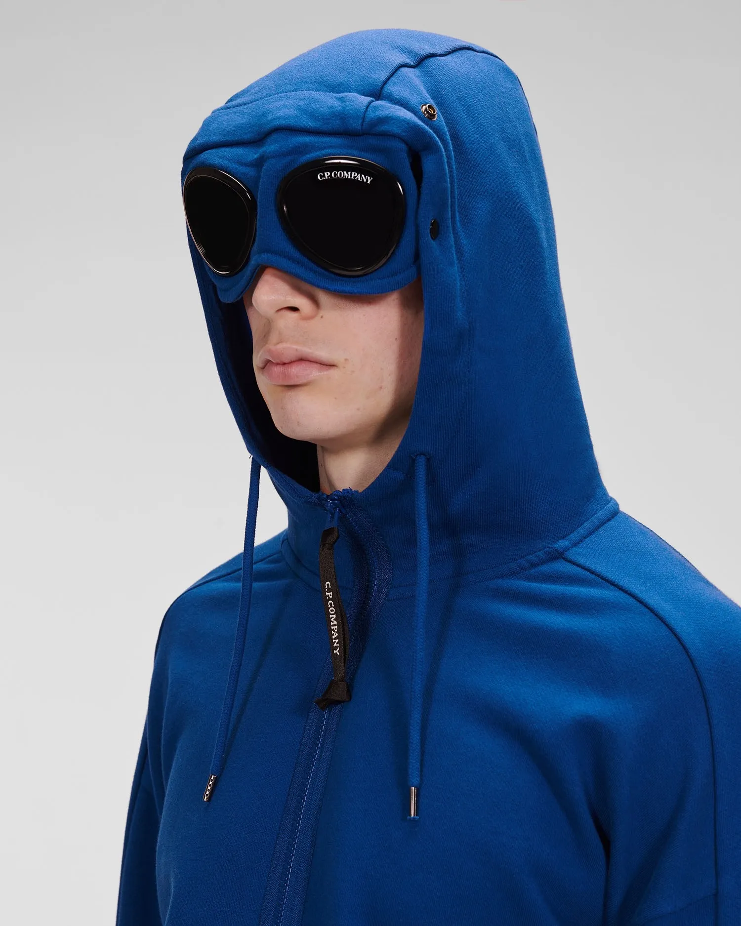 C.P. COMPANY ZIP THROUGH GOGGLE HOODY BLUE QUARTZ